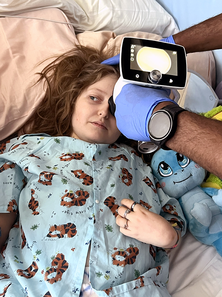 Sophie undergoing an eye pressure exam in the hospital
